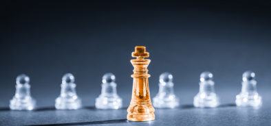 gold chess piece in front_policy_leader_representation (bigstock 115016555)_web.jpg